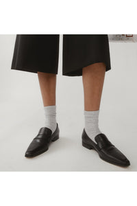 vegan leather loafers worn with socks and shorts, edie collective jane loafers
